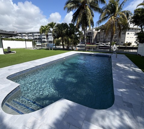 Clean residential swimming pool after maintenance